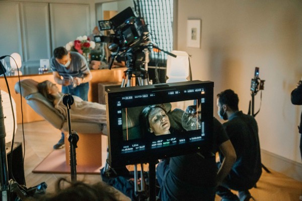 Director’s monitors and crew in a studio during a commercial shoot