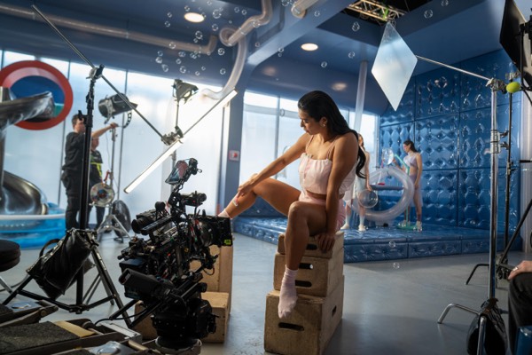 Camera on a crane and an actress on a studio set