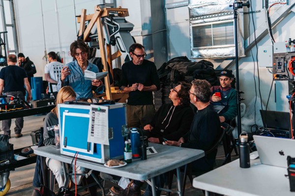 The crew watching the take on monitors in the stage