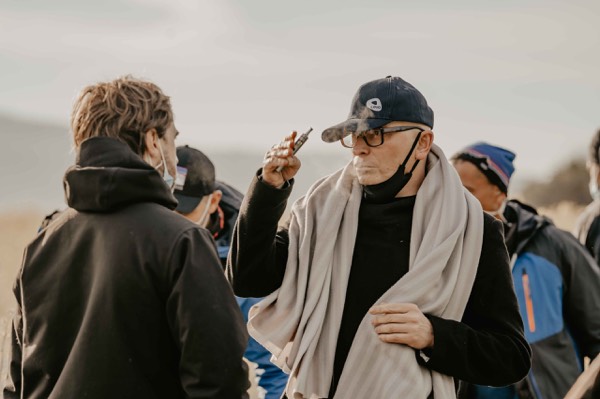 The crew talking between takes outdoors