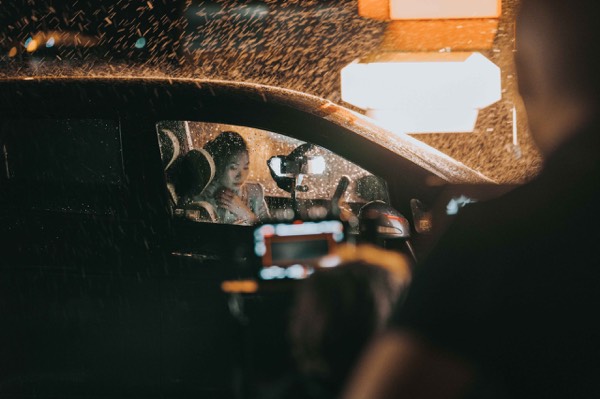 Camera filming a scene in a car