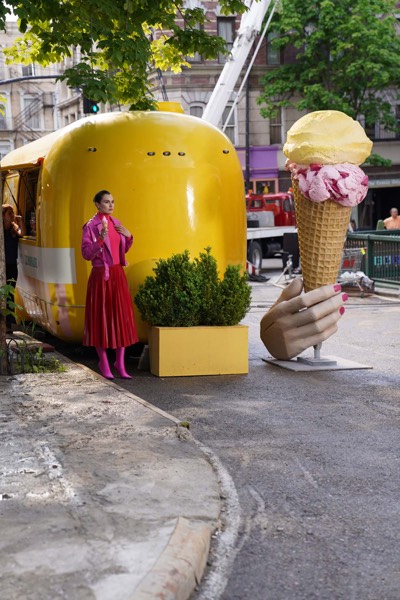 Yellow set piece and an actress in a street during the shoot