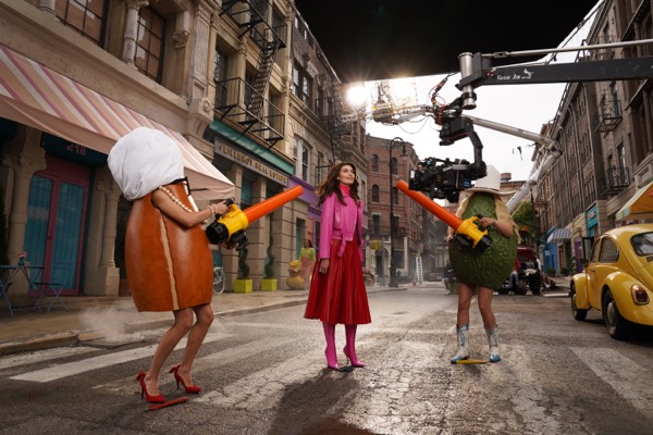 Scene with actors in product costumes on a street set