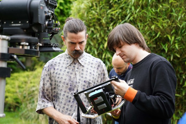 Director and actor checking the shot on a tablet