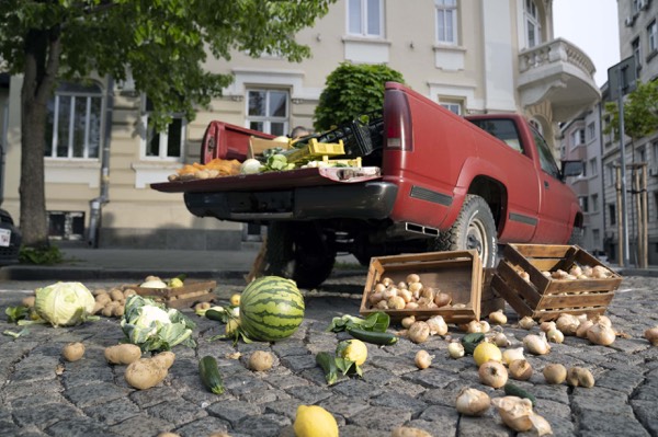 Set with scattered vegetables and a truck in a street