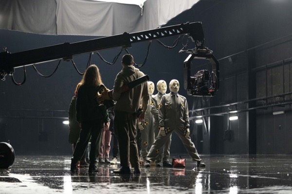 Cast and crew under studio lights