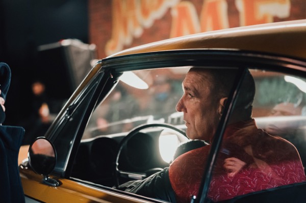 Actor at the wheel of a car on a commercial shoot