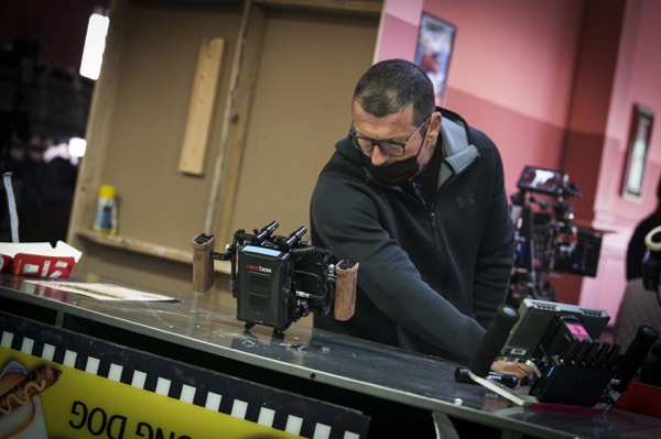 Crew member preparing props on set